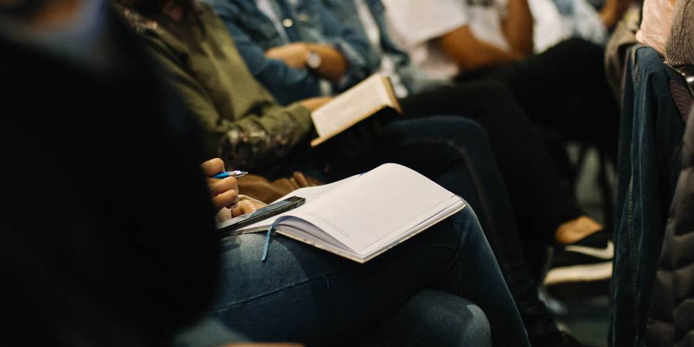 People using their Bibles during during Bible study