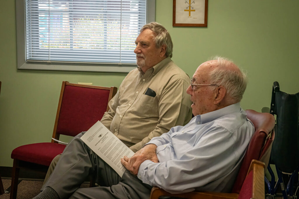 Older adults discussing the Bible study